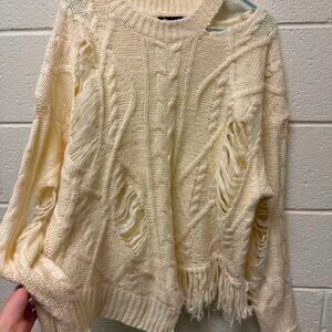 Cream Distressed Cable Knit Sweater with Fringe Hem – Cozy Statement Piece